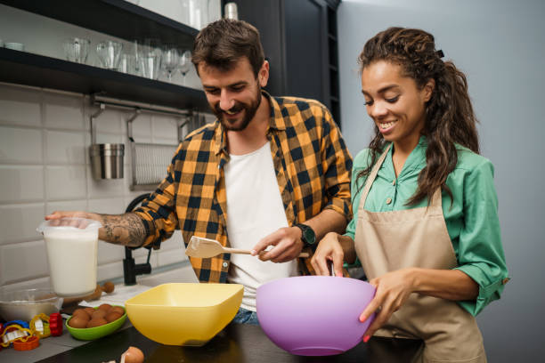 istock Young couple making cookies 1250612859