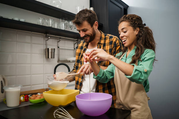 istock Young couple making cookies 1250612936