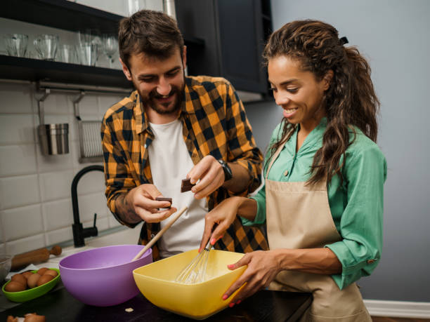 istock Young couple making cookies 1250613052