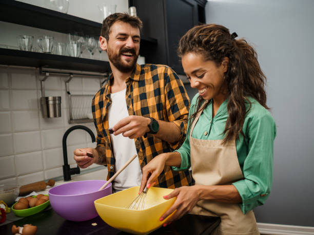 istock Young couple making cookies 1250613814