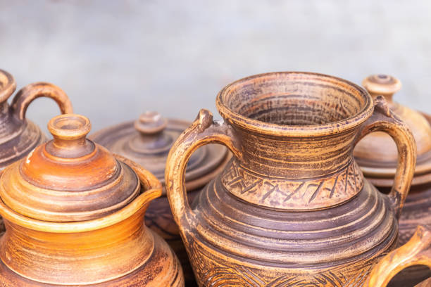 istock Different jugs on a gray background close-up, selective focus 1250618003