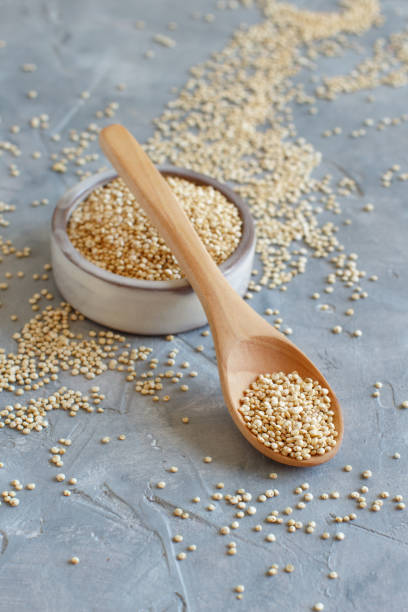 istock Raw dry white quinoa seeds close up 1250618214