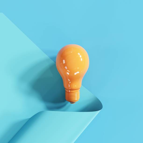 istock Orange color light bulb on blue color background. 3D Render. 1250618491