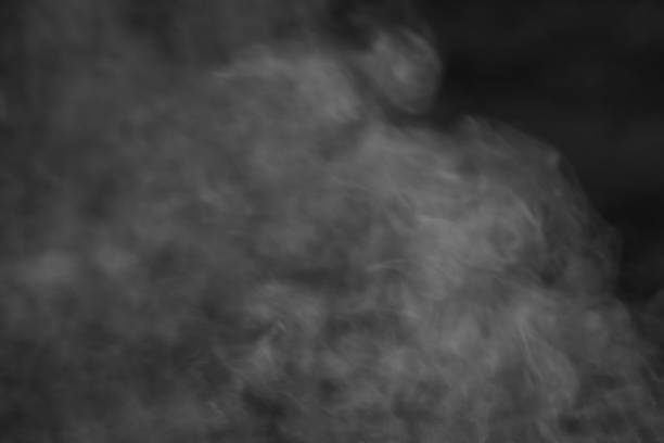 istock Fog or smoke on a dark background closeup, abstract background 1250618510