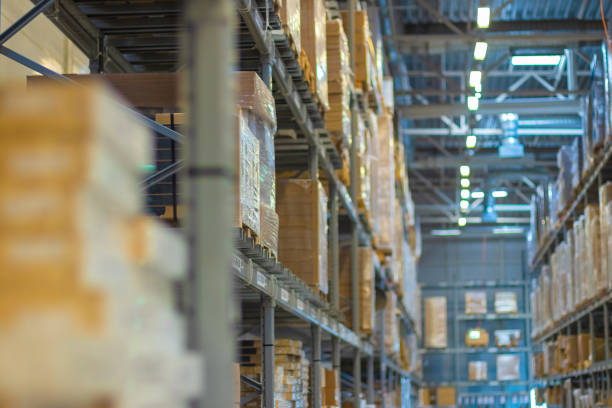 istock Blurred warehouse with goods / look up. Logistics distribution business, cargo storage, concept. 1250619797