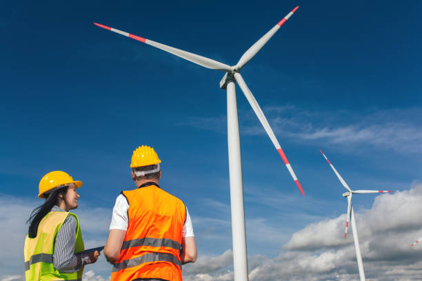 istock Windmill engineers inspection and progress check wind turbine 1250620929