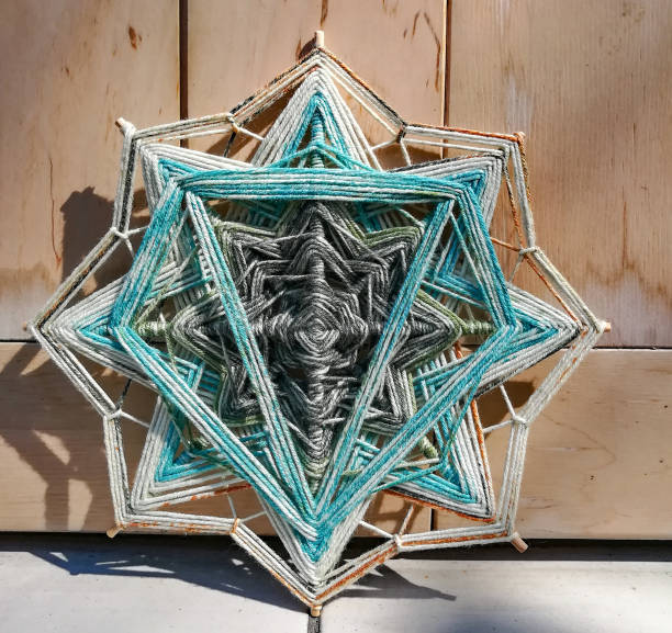 istock Woven bright God's eye mandala home talisman 1250620947