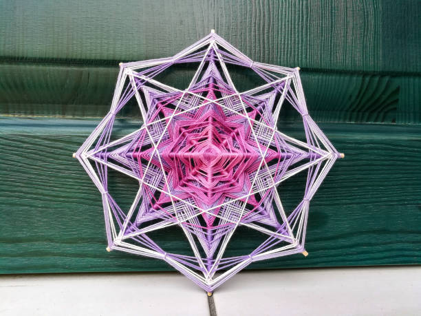 istock Woven bright God's eye mandala home talisman 1250621139