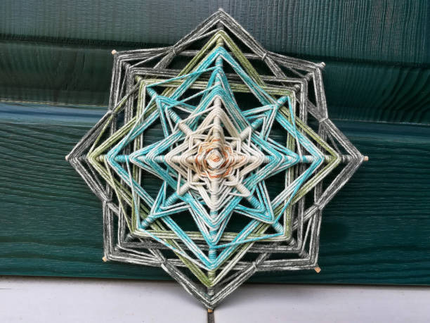 istock Woven bright God's eye mandala home talisman 1250621160