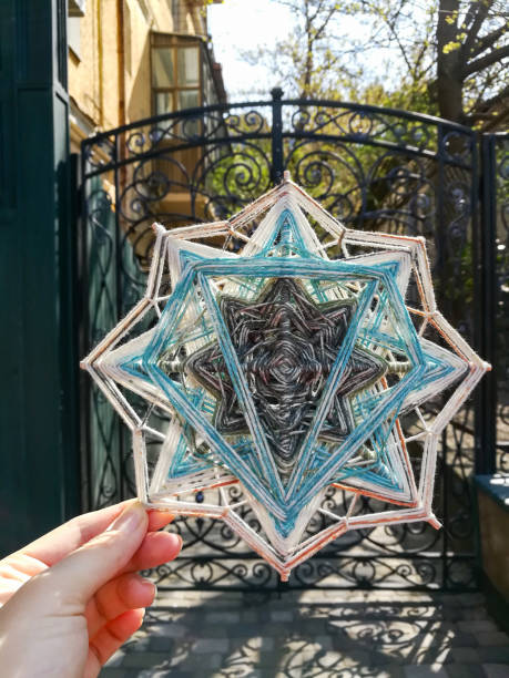 istock Woven bright God's eye mandala home talisman 1250621188
