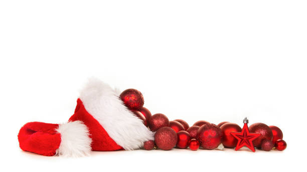 istock Santa's hat with red christmas decoration balls on a white background 1250621226