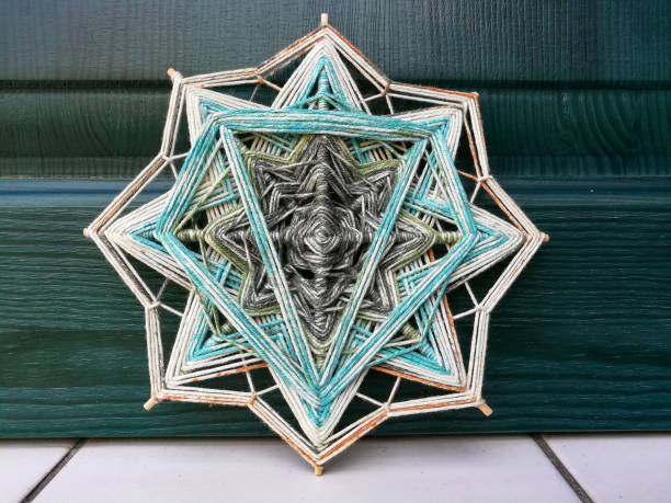 istock Woven bright God's eye mandala home talisman 1250621272