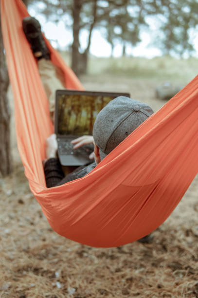 istock Portrait of a cheerful man working on computor from a remote place 1250623146