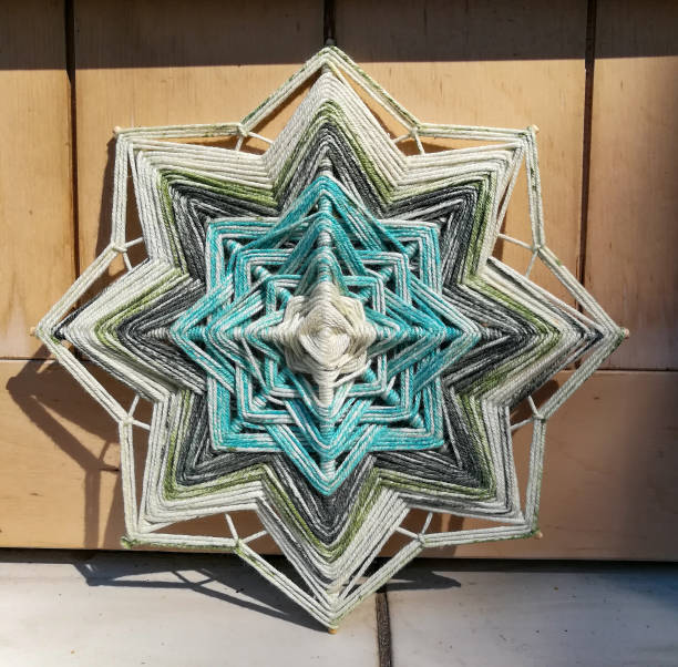 istock Woven bright God's eye mandala home talisman 1250623318