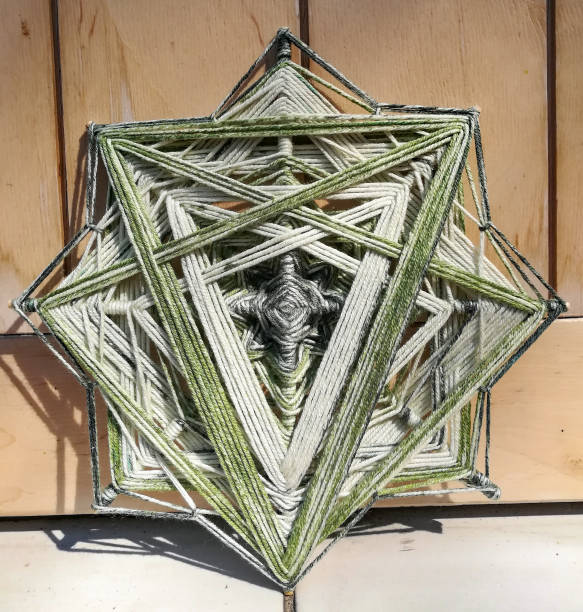 istock Woven bright God's eye mandala home talisman 1250624431