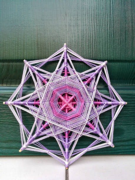 istock Woven bright God's eye mandala home talisman 1250624452