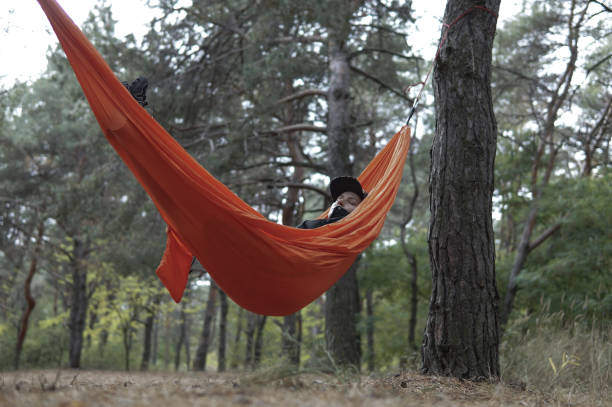 istock Woman Hiker Relaxing in Hammock 1250624462