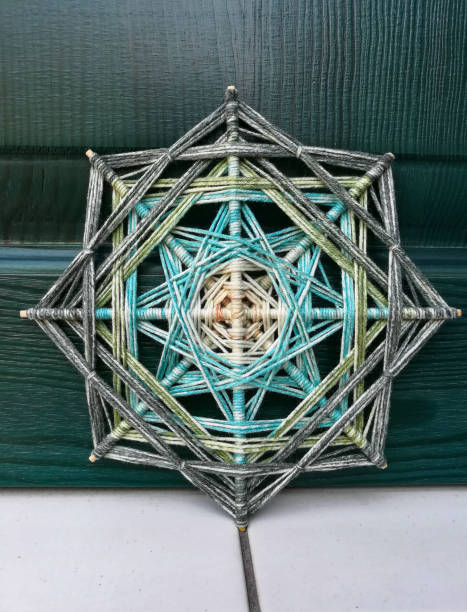 istock Woven bright God's eye mandala home talisman 1250624466