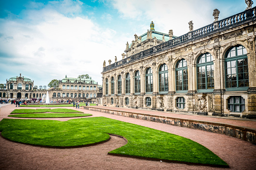 Hanover, Germany-April 09,2015:Unindentified People enjoying sunny Spring Day in front of Town Hall aka Rathaus by the Pond