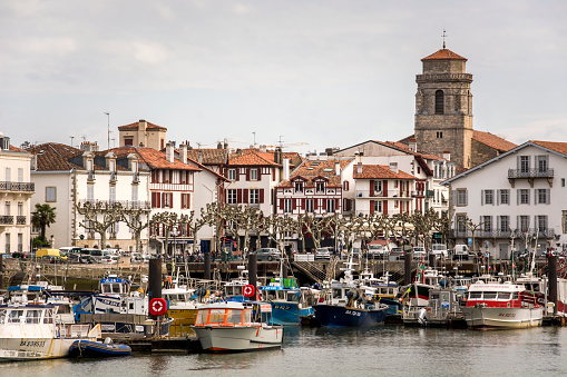 Colorful traditional basque houses in port of Saint-Jean-de-Luz Old Town, France.