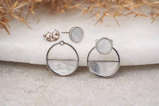 istock Elegant silver earrings with white marble. 1250625822