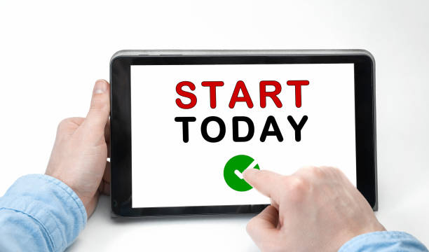 istock Male hands holding tablet pc with text START TODAY on white background 1250626171
