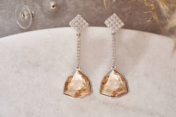 istock Earrings isolated, with white crystals and diamonds. 1250626227
