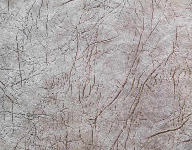 istock Textural background in gray tones. Wallpaper with an abstract pattern. 1250628659