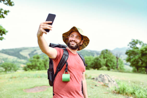 istock Latino Male Taking Hiking Selfie On Mountain 1250633104