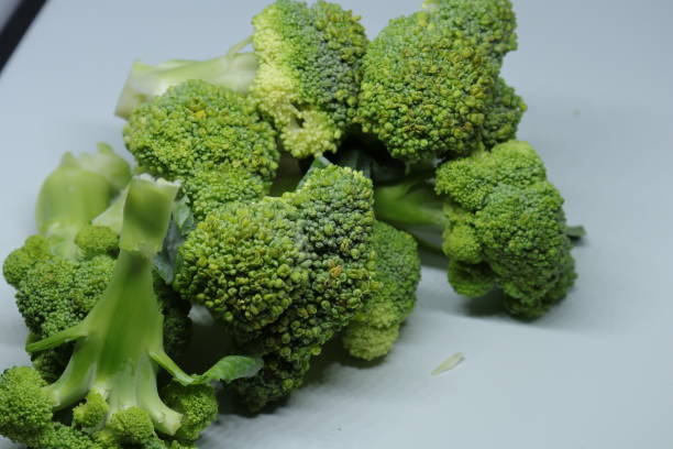 istock Fresh healthy broccoli isolated on white background 1250633118