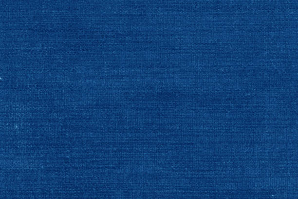 istock Blue fiber texture polyester close-up. tissue structure closeup. fine grain felt fabric background 1250636728