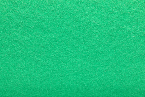 細かい粒は緑の生地を感じま�した。テクスチャの背景。ライトグリーンのフリーシーの背景。シャギー繊維表面。 - felt textured textured effect textile ストックフォトと画像