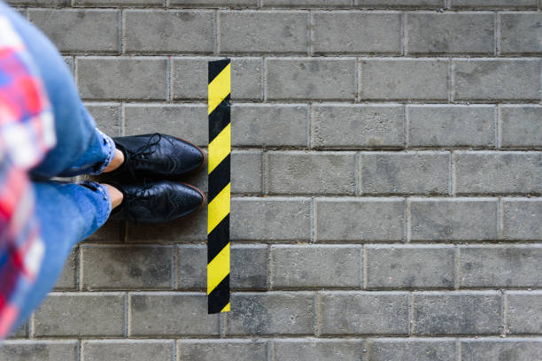 istock Standing near border queue line on street 1250637213