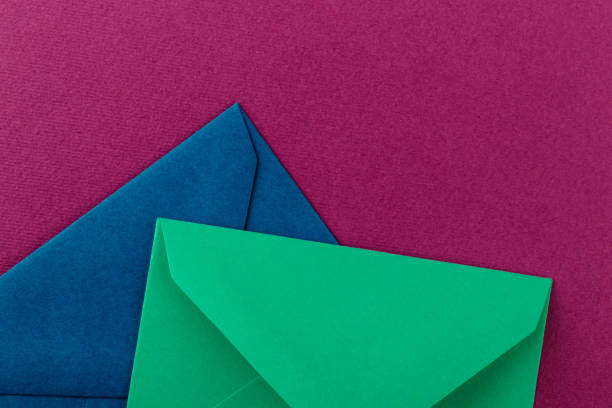 istock Colorful envelopes on a purple background. 1250638834