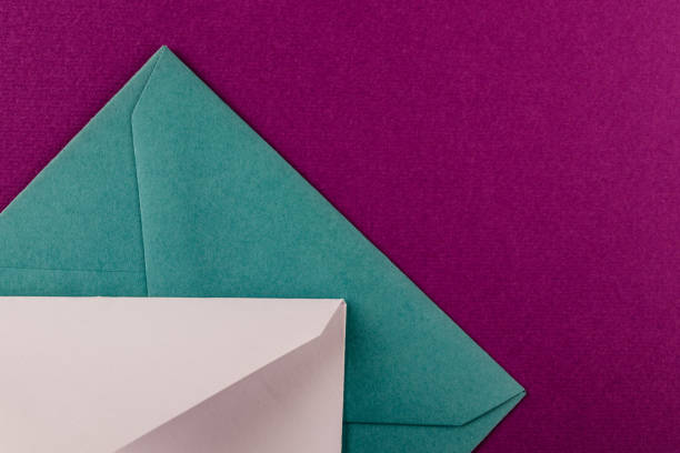 istock Colorful envelopes on a purple background. 1250638843