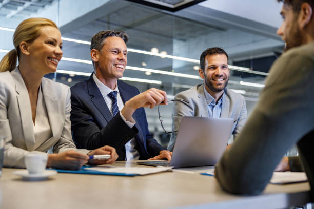 istock Happy human resource team talking to a candidate on job interview. 1250640276