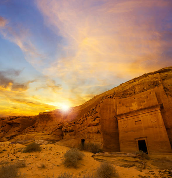Ancient tombs at sunset at the Mada'in Saleh archaeological site near Al Ula, Saudi Arabia Mada'in Saleh, also known as Al-Ḥijr or "Hegra", is an archaeological site located in the area of Al-`Ula within Al Madinah Region in the Hejaz, western Saudi Arabia. A majority of the remaining tombs date from the Nabatean kingdom. The site constitutes the kingdom's southernmost and largest settlement after the capital Petra. al madinah photos stock pictures, royalty-free photos & images