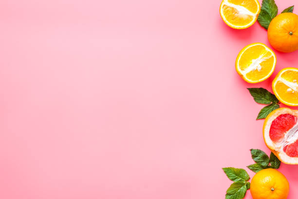 istock Oranges and grapefruits with leaves on table top view copy space 1250640298