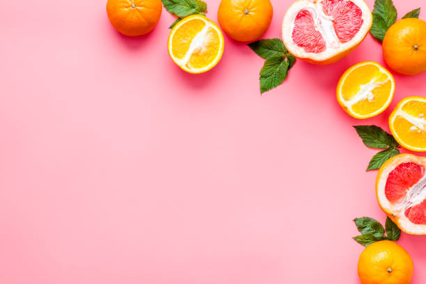 istock Oranges and grapefruits with leaves on table top view copy space 1250640396