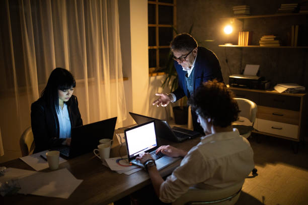 istock Business team brainstorming late at night in office 1250640441