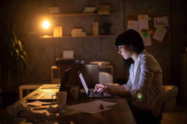 istock Dedicated businesswoman working late at office 1250641602