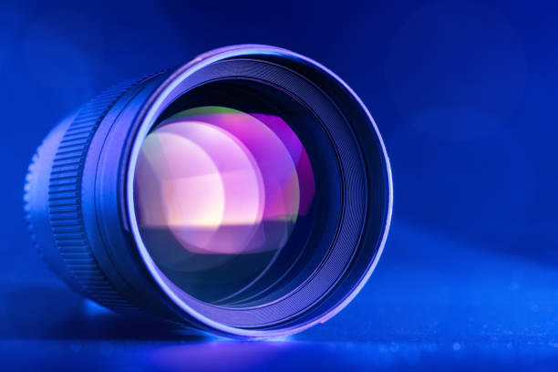 istock The camera lens with blue backlight. Optics. Horizontal macro photo 1250642005