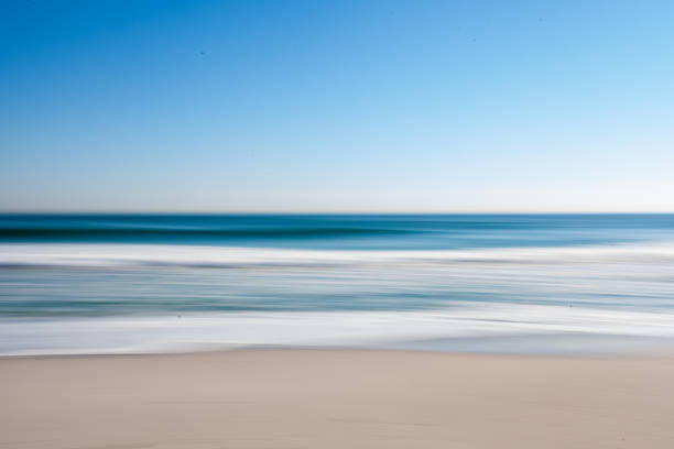 istock Abstract shot of sunny beach, ocean, sky (intentional camera movement) 1250644626