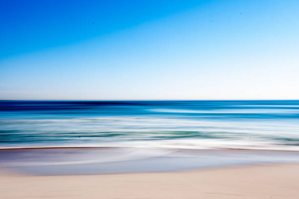 istock Abstract shot of sunny beach, ocean, sky (intentional camera movement) 1250644781