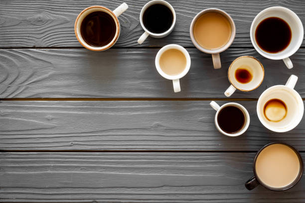 istock Many cups of coffee on wooden table top-down copy space 1250645967