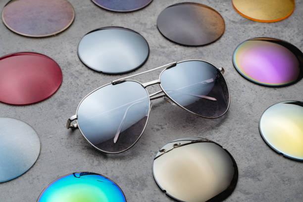 istock Assortment of colored lenses for sunglasses on table in optical store 1250646830