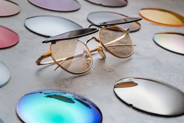 Photo of Close up of fashion glasses with changeable colored lenses