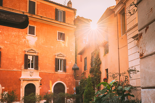 Rome, Italy. Sunshine Sun Shine Above Roofs Old Houses.