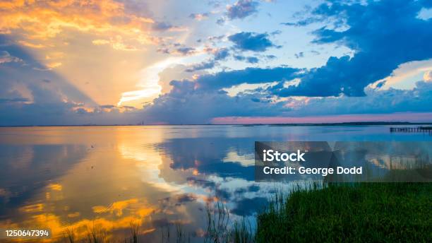 Vibrant Sunset At Mobile Bay Alabama Stock Photo - Download Image Now - Beach, Coastline, Scenics - Nature