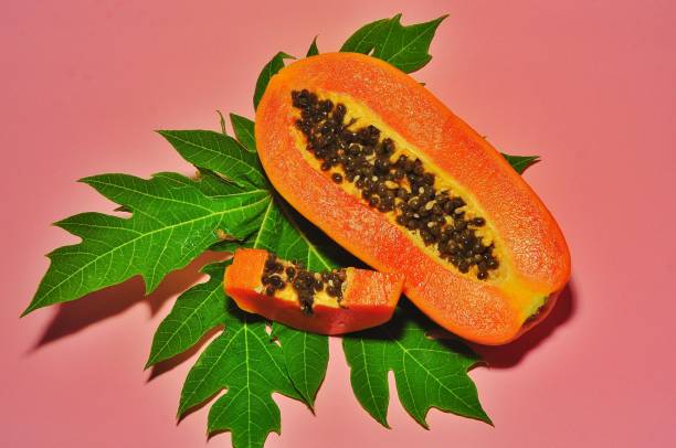 istock Papaya fruit isolated on pink background 1250651319